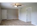 Spacious living room featuring laminated wood floors, neutral-colored walls, and a ceiling fan at 525 12Th Sw St # 26, Hickory, NC 28602
