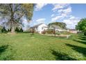 View of large backyard, showcasing a wooden deck and space for outdoor entertaining at 630 S Myrtle School Rd, Gastonia, NC 28052