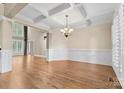 Formal dining room featuring hardwood floors and tray ceiling at 4800 Pimlico Ln, Waxhaw, NC 28173