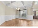 Formal dining room with hardwood floors and wainscoting at 4800 Pimlico Ln, Waxhaw, NC 28173