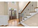 Two-story foyer with hardwood floors and elegant staircase at 4800 Pimlico Ln, Waxhaw, NC 28173