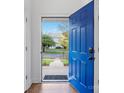 Open door revealing a view of the front yard and walkway at 16518 Ambassador Park Dr, Huntersville, NC 28078