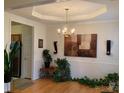 Elegant dining room with tray ceilings, chandelier and plenty of room for hosting gatherings at 4016 Holly Villa Cir, Indian Trail, NC 28079