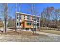 Contemporary home with wood siding and a large window at 569 Evergreen Rd, Clover, SC 29710