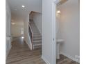 A view of an entryway with a staircase and powder room at 1209 Red River Dr, Salisbury, NC 28144