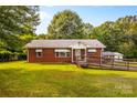 Charming brick home with a wheelchair ramp leading to the front entrance and a well-maintained lawn at 5960/5930 S Main St, Salisbury, NC 28147