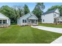 Quaint single-story home has a light exterior, a compact porch, and a freshly cut front lawn at 602 Meadow Ave, Spencer, NC 28159