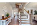 Bright entryway with hardwood floors and elegant staircase at 2402 Paddlers Cove Dr, Clover, SC 29710