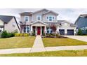 Two-story house with gray siding and a red front door at 2402 Paddlers Cove Dr, Clover, SC 29710