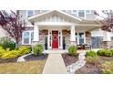 Inviting front entry with red door and landscaped walkway at 2402 Paddlers Cove Dr, Clover, SC 29710