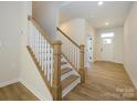 Modern staircase with light wood and white spindles at 10103 Mamillion Dr, Huntersville, NC 28078