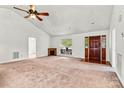 Bright living room featuring a decorative fireplace, large windows, and ample space for furnishings at 2511 Old Pond Dr, Lincolnton, NC 28092