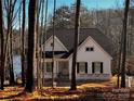 White house with black shutters, lake view, under construction at 166 Wylie Trl # 25, Statesville, NC 28677