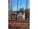 White house with black shutters, under construction, lake view at 166 Wylie Trl # 25, Statesville, NC 28677