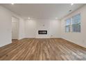 Spacious living room with hardwood floors and a modern fireplace at 327 Bezelle Ave, York, SC 29745