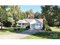 White house with a two-car garage and a well-maintained lawn at 1499 Angela Ct, Lincolnton, NC 28092