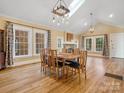 Bright dining room with hardwood floors and charming chandelier at 316 W Kingston Ave, Charlotte, NC 28203