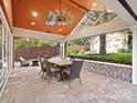 Outdoor patio with seating area, stone flooring, and backyard access at 316 W Kingston Ave, Charlotte, NC 28203