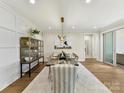 Elegant dining room featuring modern lighting, a large table, and stylish decor at 8111 Farm Crossing Ln # 2, Huntersville, NC 28078