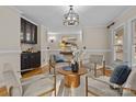 Living room with comfy seating, a coffee table, and hardwood floors at 17929 Pages Pond Ct, Davidson, NC 28036