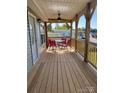 Relaxing covered front porch with stylish outdoor furniture, perfect for entertaining at 102 Elm St # 94, New London, NC 28127