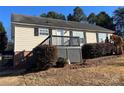 House exterior featuring a deck and well-maintained lawn at 1520 Yellowstone Ct, Gastonia, NC 28054