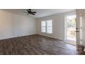 Living room with hardwood floors, door to deck and ceiling fan at 1520 Yellowstone Ct, Gastonia, NC 28054