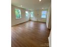 Large bonus room with carpeted floors and multiple windows at 3018 Cunningham Farm Dr, Indian Trail, NC 28079