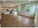 Spacious living room featuring hardwood floors and access to the backyard at 3018 Cunningham Farm Dr, Indian Trail, NC 28079