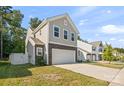 Exterior elevation shows a two-story home with stone accents, a two-car garage, and a well-manicured lawn at 3020 Pinehills Way, Mount Holly, NC 28120