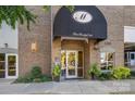 Brick building entrance with awning and glass doors at 520 E Martin Luther King Blvd # 1204, Charlotte, NC 28202