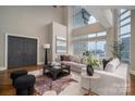 Spacious living room with city views and a cozy seating area at 520 E Martin Luther King Blvd # 1204, Charlotte, NC 28202