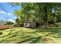 White house with boarded windows, needs renovation. Brick foundation, front porch at 3444 Marvin Rd, Charlotte, NC 28211