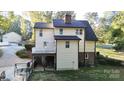 View of the back exterior featuring a raised deck and fenced yard at 1000 Hunting Ave, Lincolnton, NC 28092