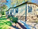 Attractive single-story home showcasing well-manicured landscaping and inviting walkway at 125 Pineville Rd, Statesville, NC 28677