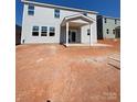 Two-story home with gray siding and a covered patio at 3014 Cunningham Farm Dr, Indian Trail, NC 28079