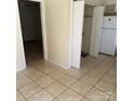 Spacious kitchen with tile flooring, ample cabinet storage, and natural light from open doorways at 1314 Milan Rd, Charlotte, NC 28216