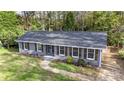 Charming ranch home with gray exterior and wooden shutters at 5731 Brookhaven Rd, Charlotte, NC 28210