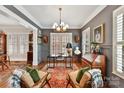 Elegant home office with wood furniture and a large desk at 4813 Cambridge Crescent Dr, Charlotte, NC 28226