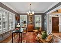 Spacious home office with wood furniture and natural light at 4813 Cambridge Crescent Dr, Charlotte, NC 28226