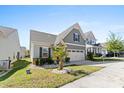 Charming two-story house with a gray exterior, two-car garage, and landscaping at 50143 Robins Nest Ln, Lancaster, SC 29720