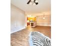 Bright, open living room features hardwood floors and seamless flow to a modern kitchen at 11264 Hyde Pointe Ct, Charlotte, NC 28262