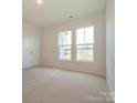 Spacious bedroom with carpeted floor and large windows at 10105 Mamillion Dr, Huntersville, NC 28078