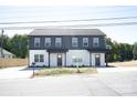 Two-story home with dual units, showcasing a modern design and a well-maintained exterior at 818 Fairview St # A, Kannapolis, NC 28083