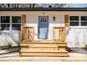 Close-up of the front entrance, highlighting a newly constructed porch with blue door and wooden accents at 919 N Weldon St, Gastonia, NC 28052