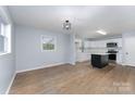 Bright kitchen features new stainless appliances, white cabinets and a central island at 919 N Weldon St, Gastonia, NC 28052