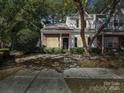 Brick townhouse with landscaping and walkway at 10105 Reindeer Way Ln, Charlotte, NC 28216