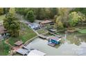 Aerial view of waterfront homes, docks, and lush greenery providing a serene and picturesque lakeside community at 287 Ben Eller Ln, Taylorsville, NC 28681