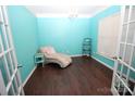 Bright office with light teal walls, hardwood floors, and French doors at 628 Barcroft Ln, Fort Mill, SC 29715