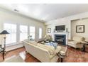 Spacious living room featuring a fireplace and hardwood floors at 19556 Makayla Ln, Cornelius, NC 28031